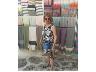 My beautiful mom using the water bottle holder in Mykonos!